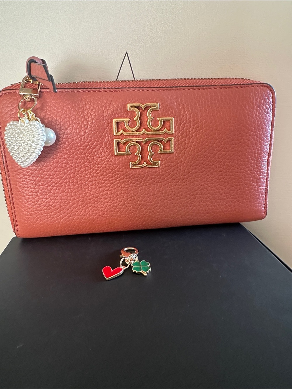 Tory Burch Burnt Orange Pebbled Leather Zip Wallet with Gold Logo with 2 charms